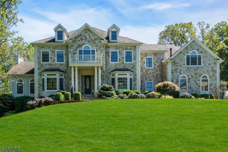 Welcome home to this stately custom colonial, perfectly situated on over two acres on a peacefully quiet cul de sac !