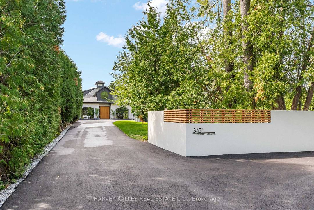 A rare architectural luxury waterfront residence blends concrete, glass, steel, and warm wood to create a one of a kind Boho modern retreat.