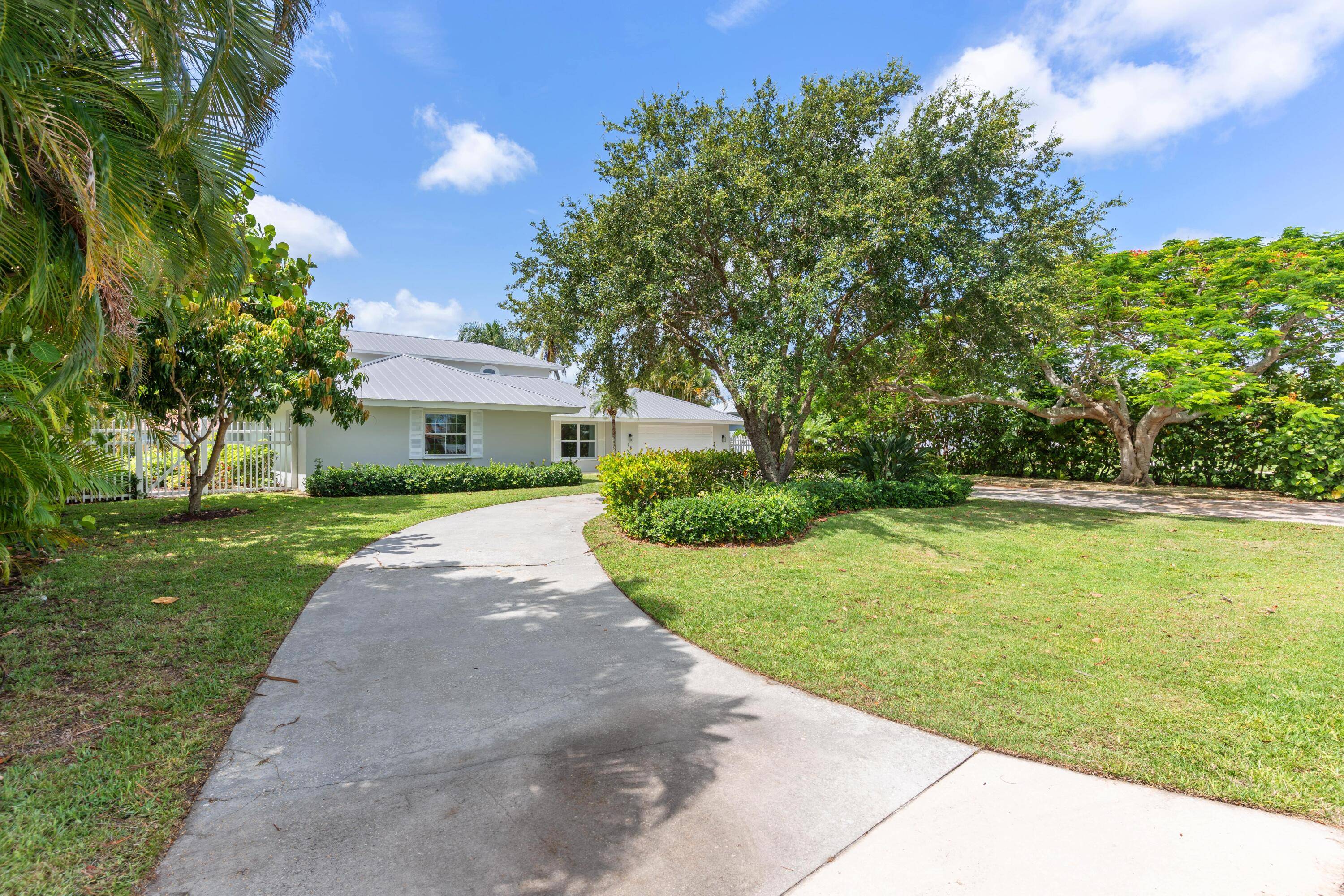 Welcome to 25 Park Avenue, a stunning waterfront home located on a deep water canal just an eighth of a mile from wide open intercoastal access.