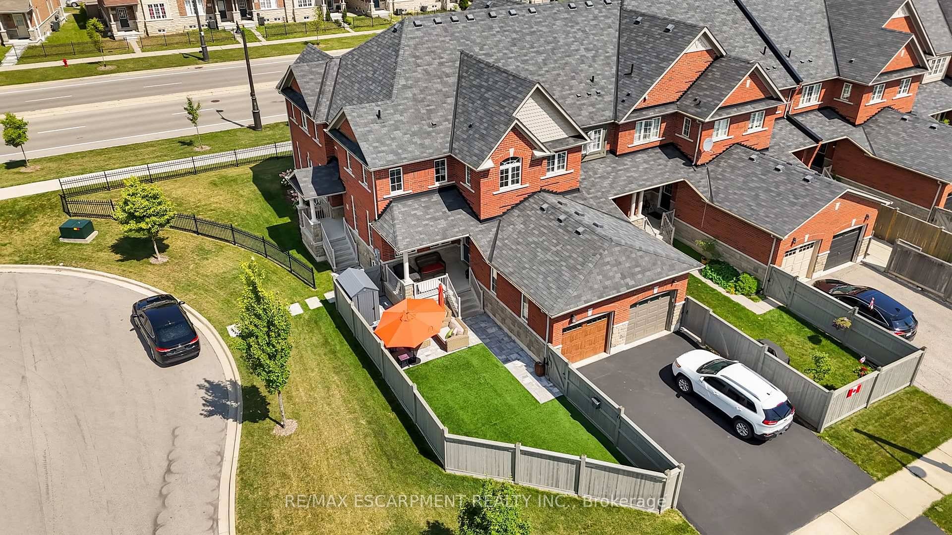 Welcome to 100 Burke Street ; a beautiful cared for end unit townhouse in sought after Waterdown Wes.