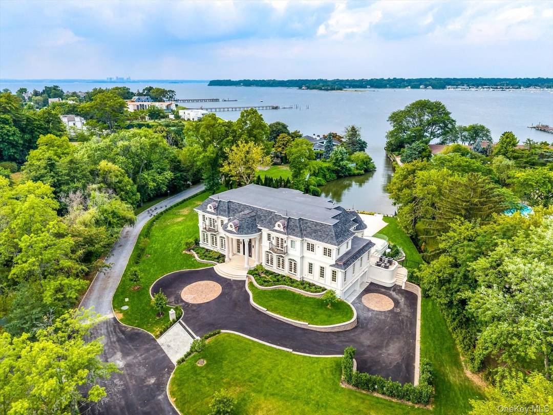 Experience unparalleled luxury and craftsmanship in this spectacular new construction nestled on over an acre of pristine waterview property in the heart of Kings Point.
