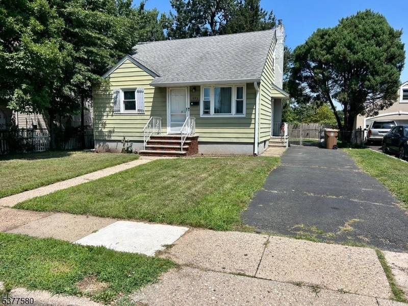 Step inside 1003 Woodlawn Avenue and discover a classic Cape Cod updated for modern living.