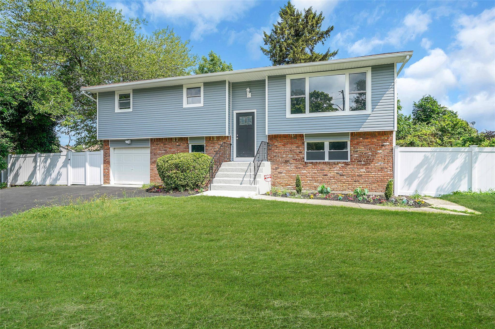 Fantastic renovated high ranch located on a quiet residential street in Deer Park.