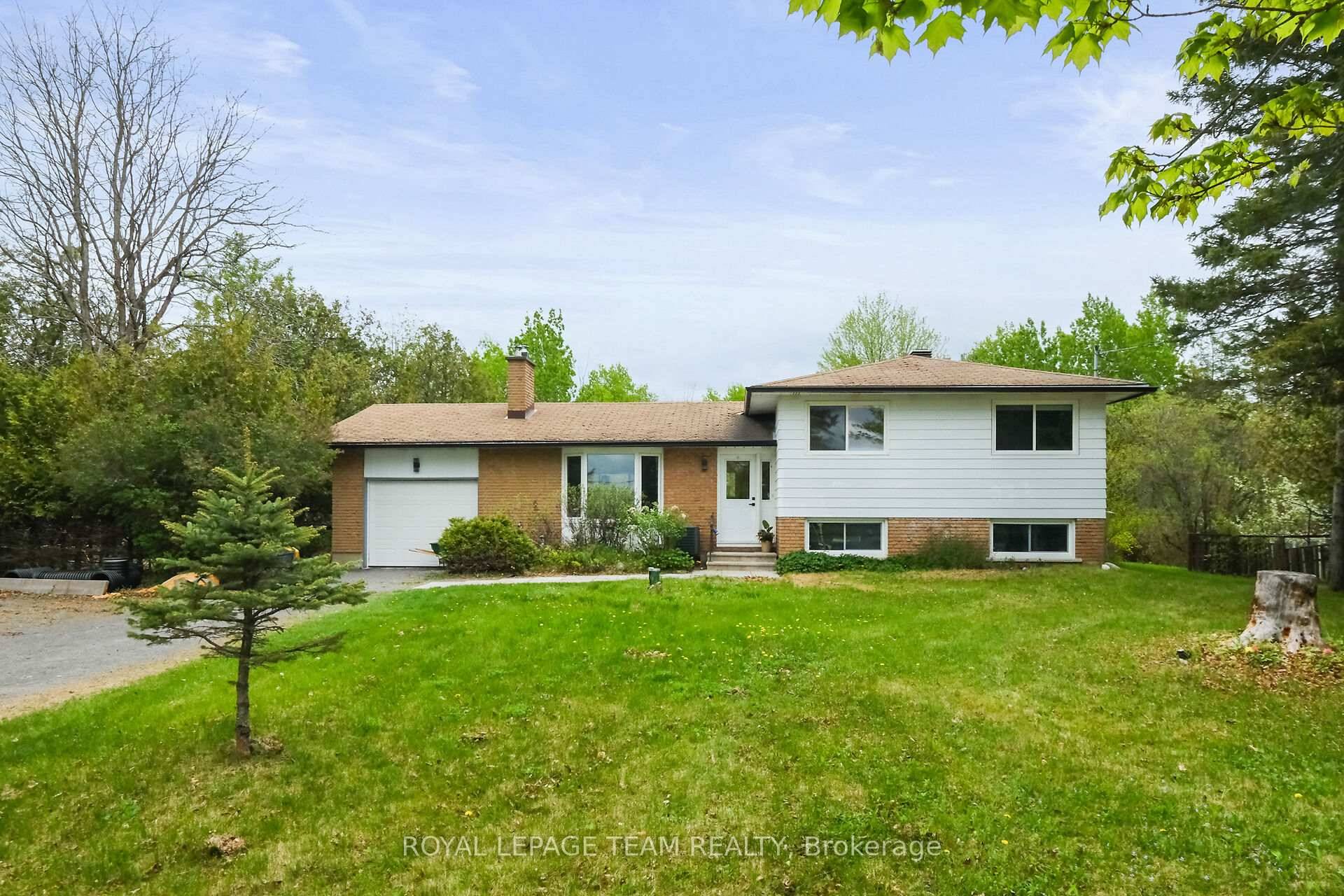 Welcome to this split level single family home tucked in amongst a mature tree setting !