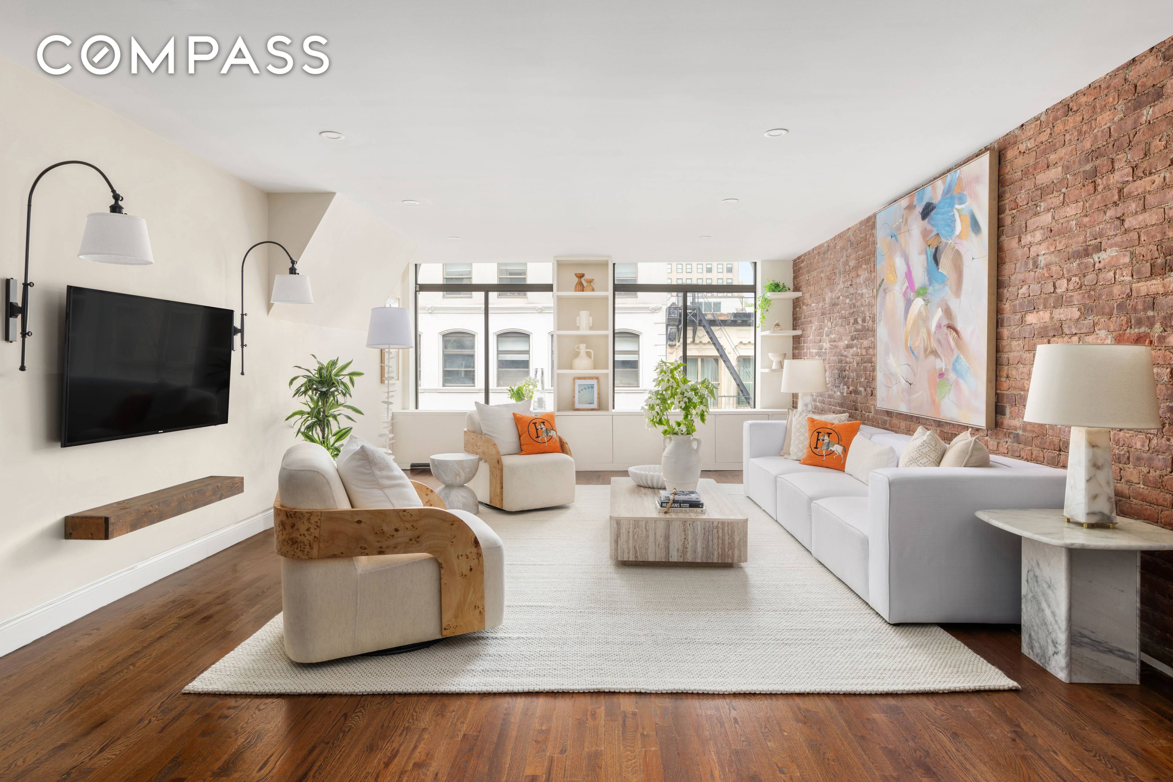 Welcome to a pristinely renovated three bedroom two bathroom home that perfectly captures the essence of sophisticated TriBeCa living.