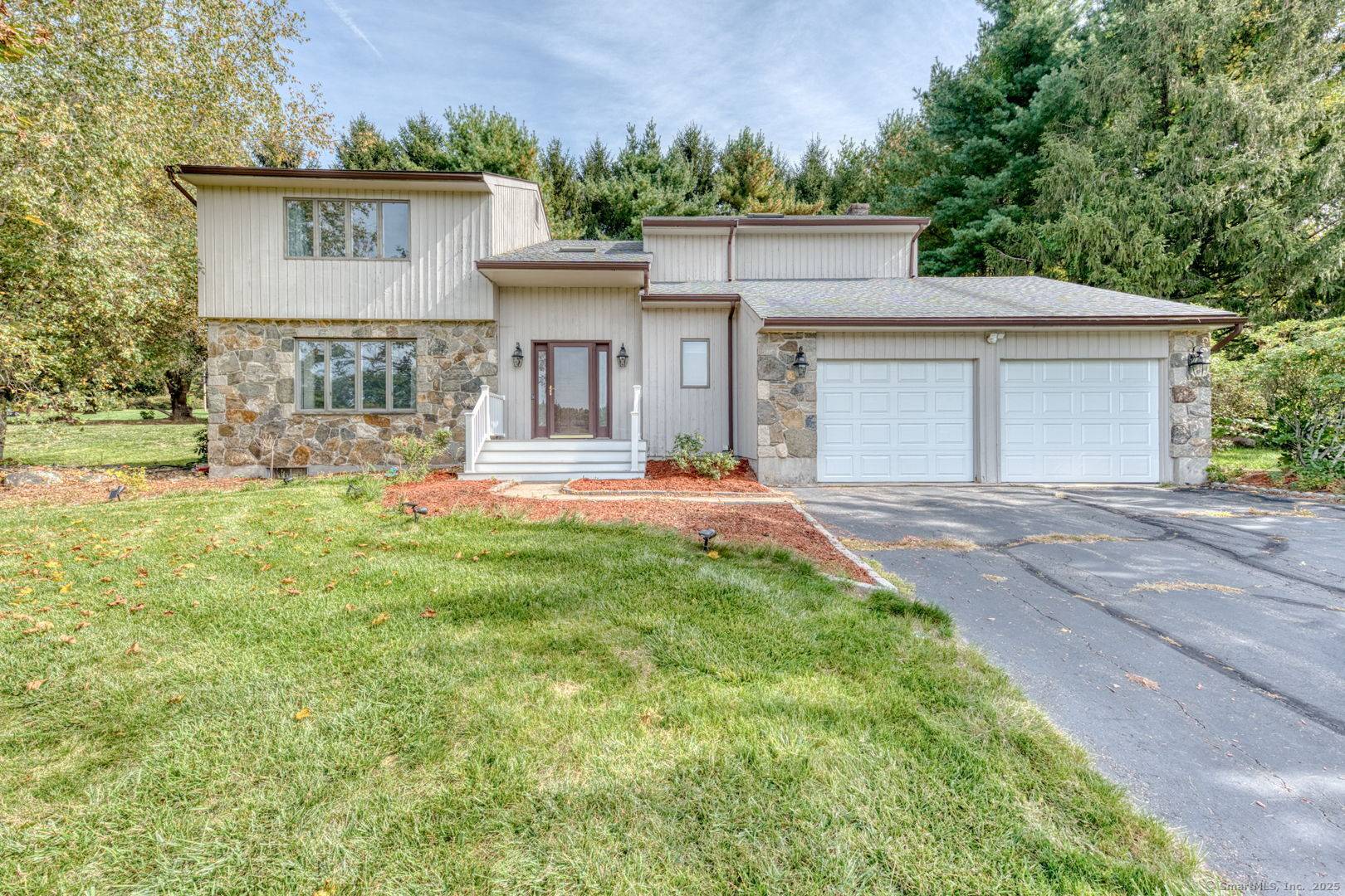 Welcome to this contemporary style home located at 11 Kupchunos Dr in South Windsor, CT.