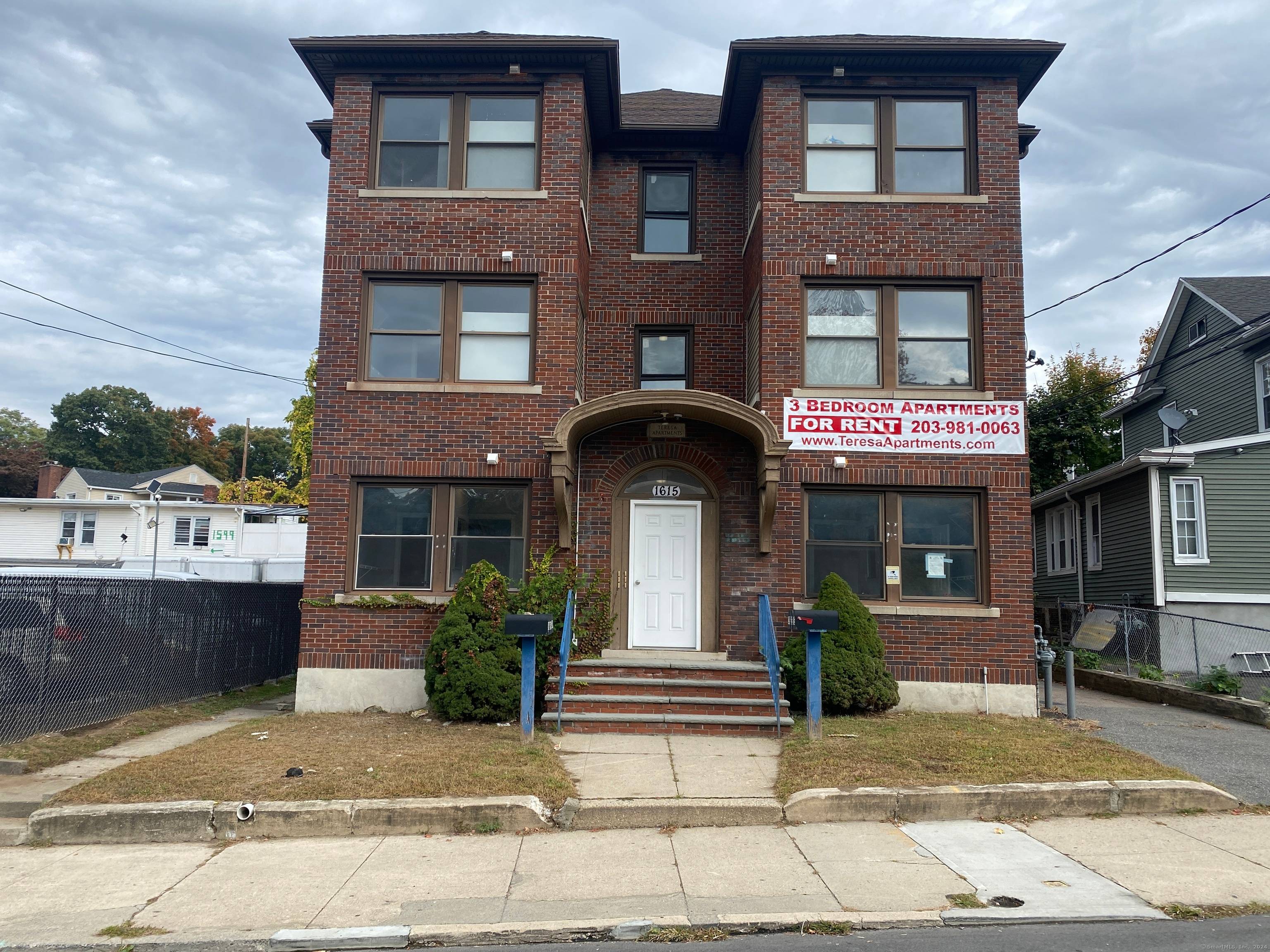 Totally remodeled 6 unit residential brick building with 6 bay brick garage.