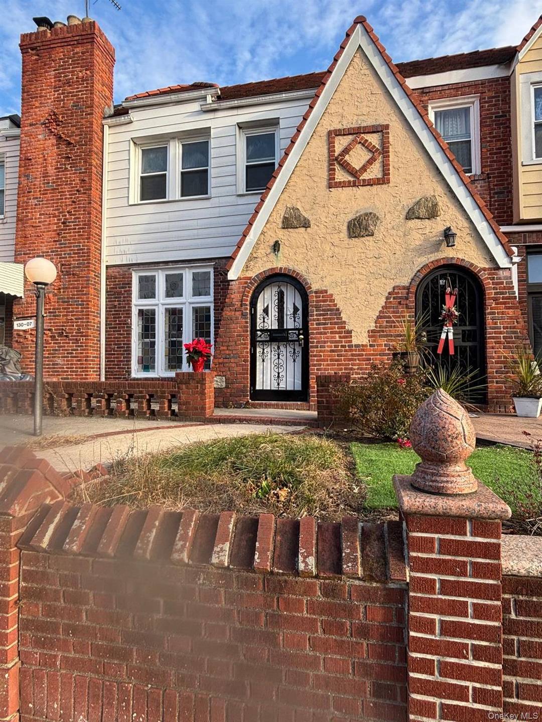 This beautifully maintained Tudor is filled with timeless charm, featuring beamed ceilings, a sunken living room with a fireplace, 3 bedrooms, 1.