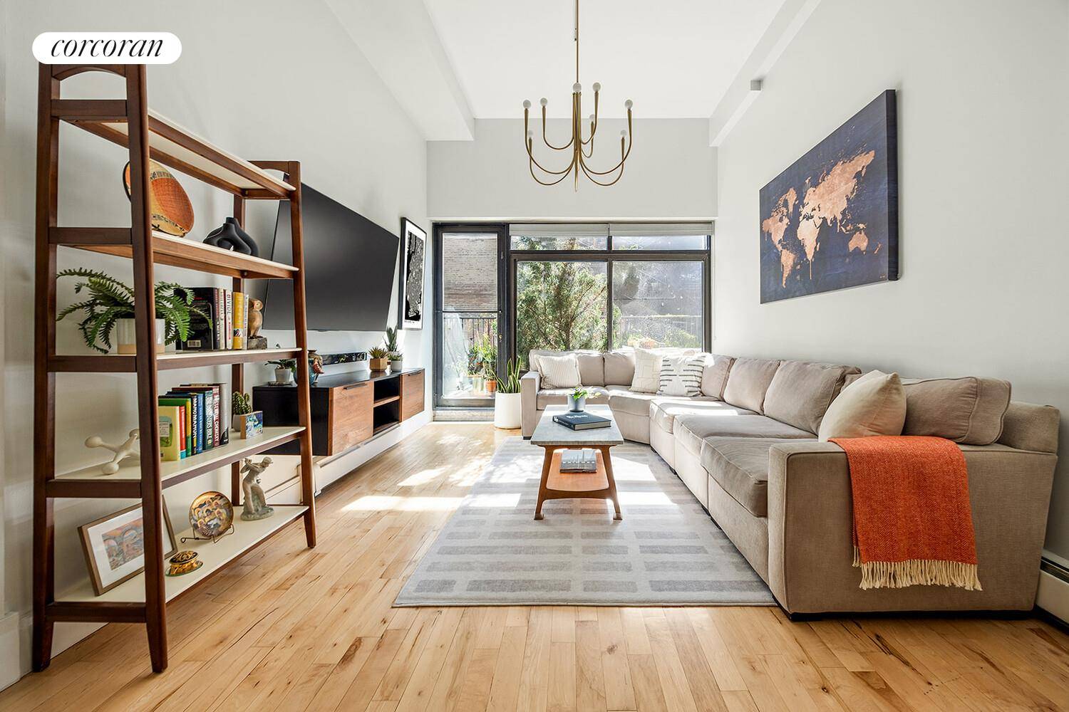 Enjoy generous light filled interiors and a large private outdoor space in this beautiful 2 bedroom, 2 full bathroom home with soaring 12 foot ceilings.