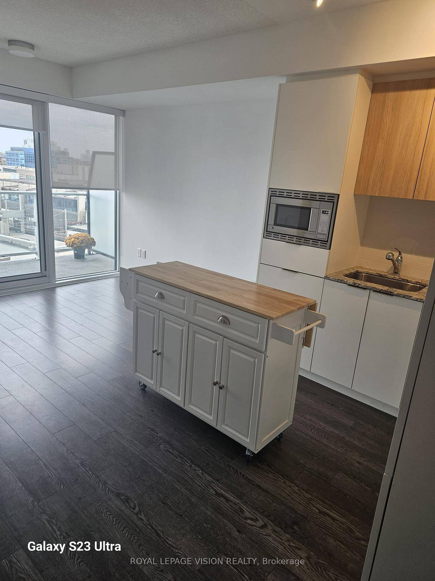 Professionally painted and cleaned, Kitchen Center Island, One bedroom Maple model 495 sq ft per builders floorplan huge full size balcony with 2 walkouts, one parking spot, North facing overlooks ...