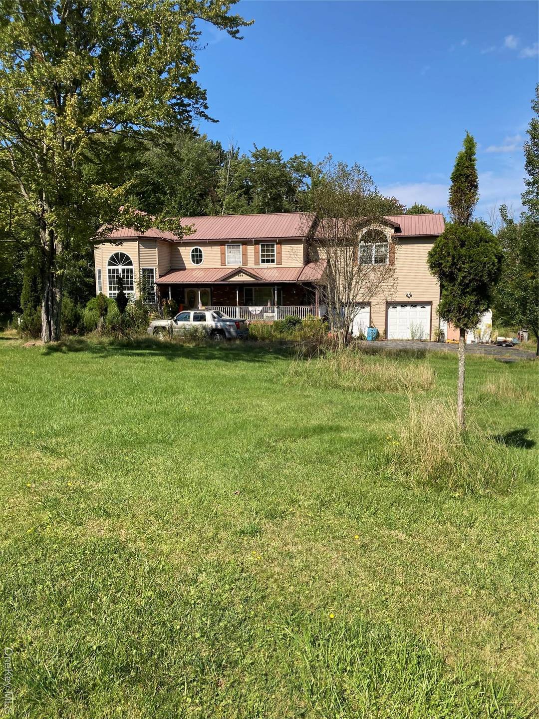 Spacious 3, 588 sq ft Colonial set back from a quiet country road, offering privacy and a peaceful rural setting.