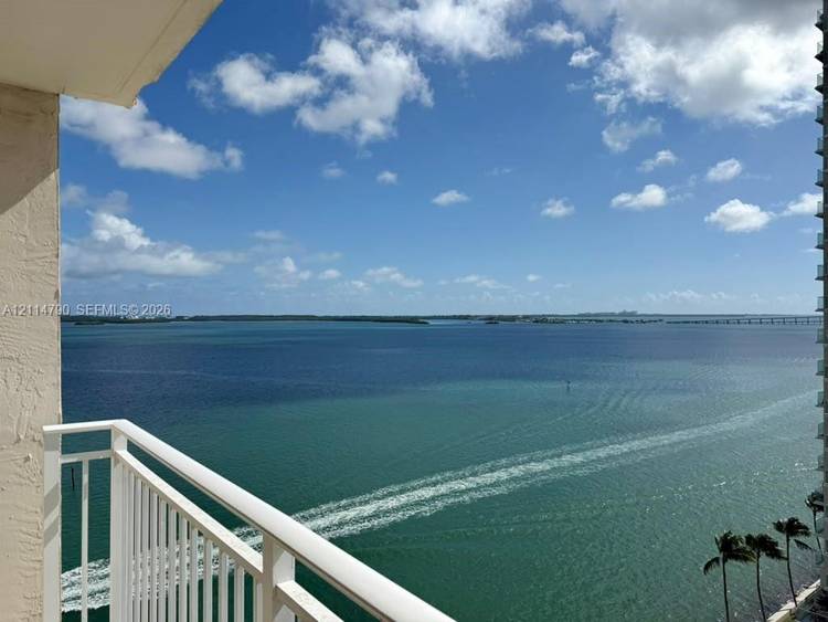 Unique 2 bedroom DEN office unit with porcelain tile throughout, an open kitchen, and south facing bay and Key Biscayne views.