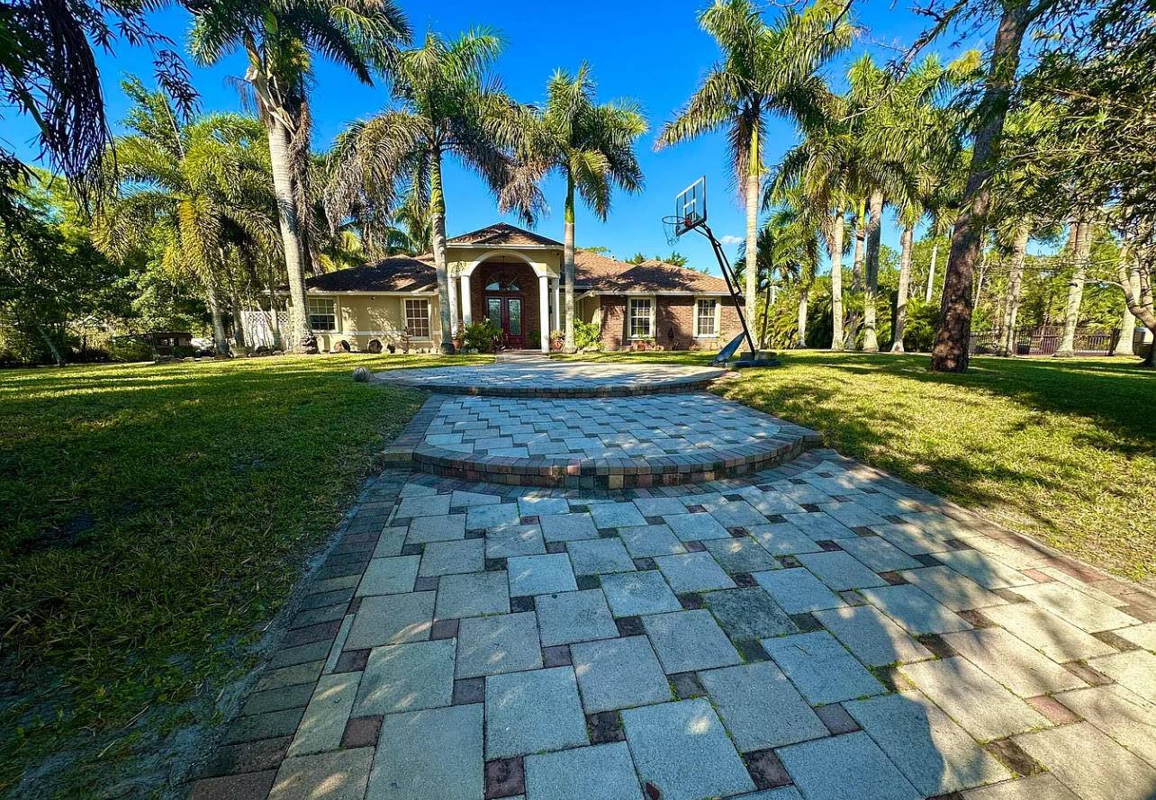 Beautiful home for sale featuring an attached efficiency with a private entrance through the backyard.