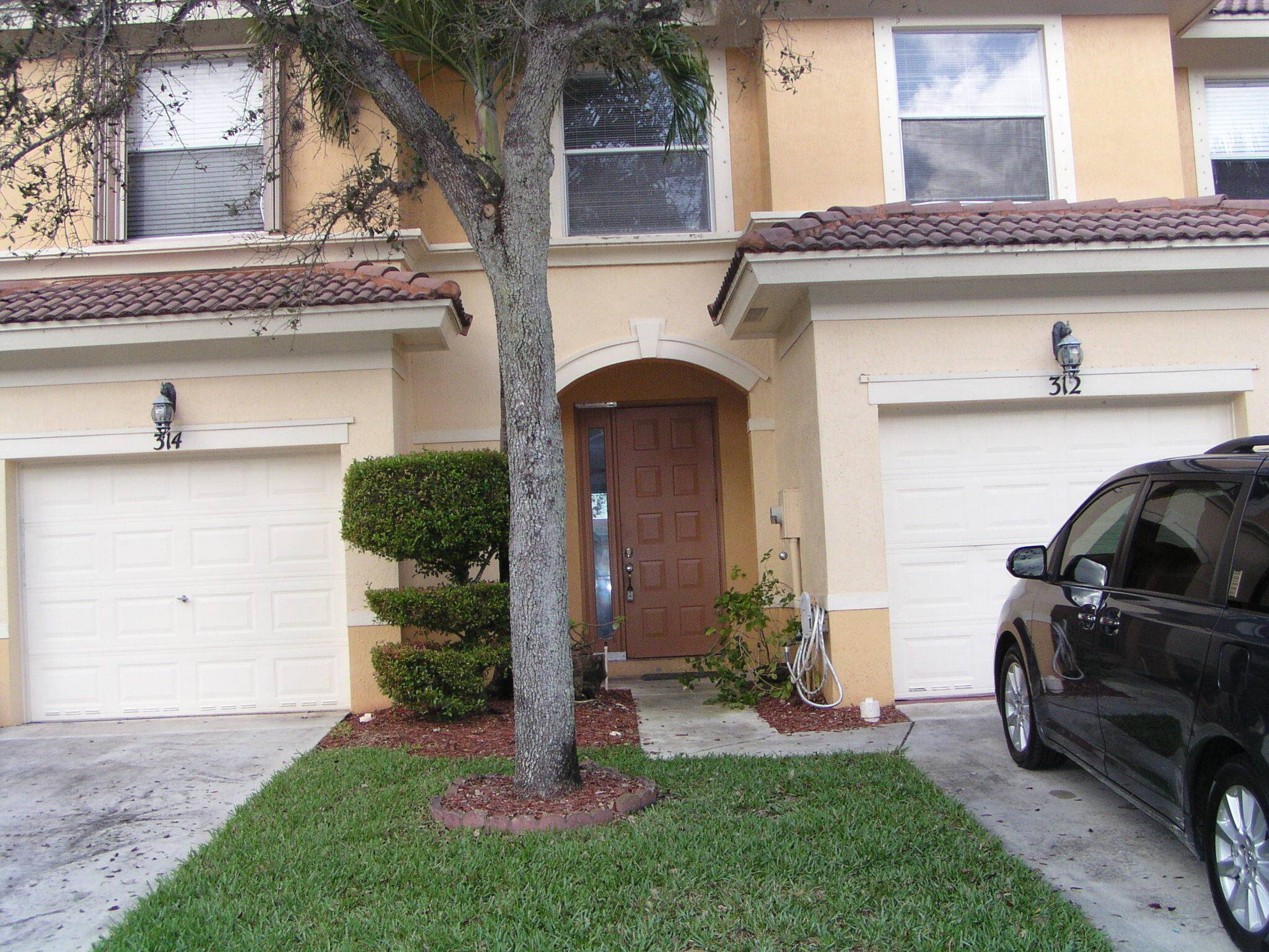 Lake Front Townhome in gated community with tile on 1st floor and wood on 2nd floor, stainless steel appliances, washer, dryer, central air, 1 car garage, community pool and children ...