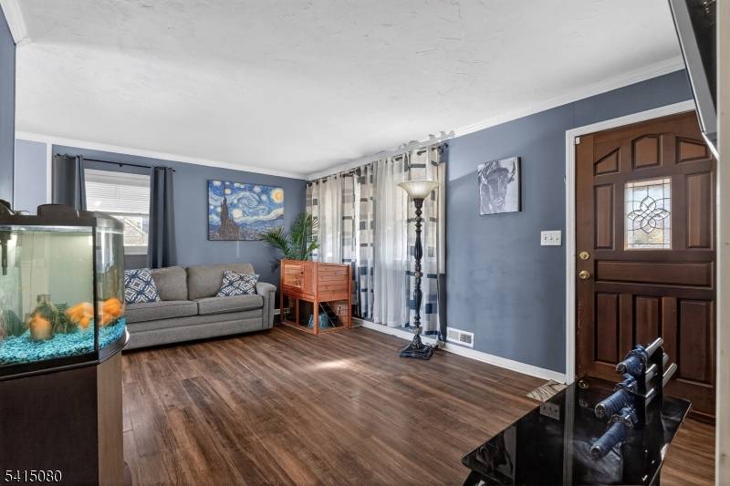 Move right into this beautifully maintained 4 bedroom Cape Cod on a prime corner lot with a side entry 2 car garage, oversized driveway, and a private fenced backyard perfect ...