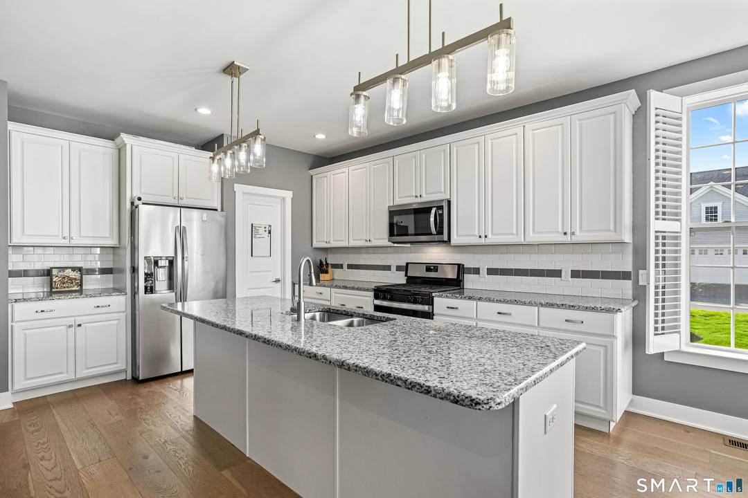 The ease of low maintenance living meets the space and comfort of a single family home in this stand alone home located in the desirable Enclave at Taunton Lake, a ...