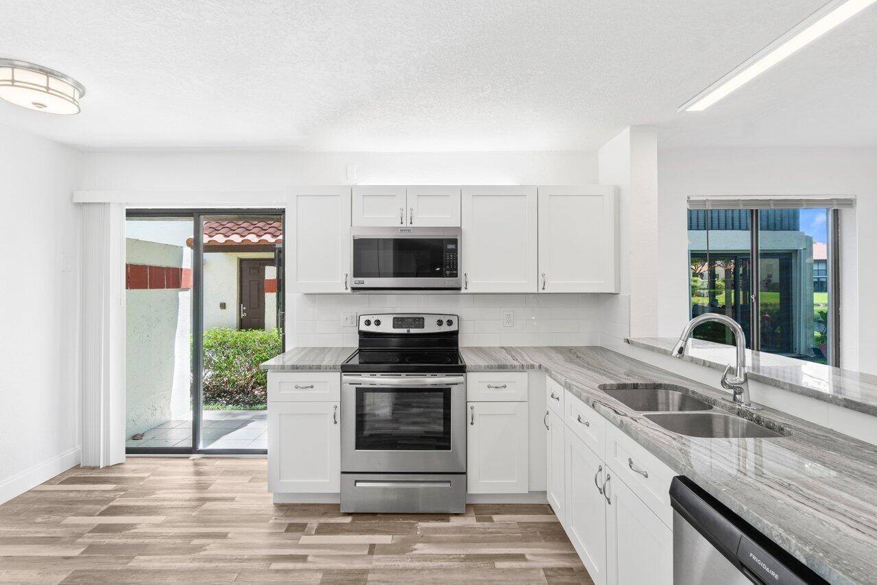 Stunning 3 bedroom 2 bath first floor condo with gorgeous lake views.