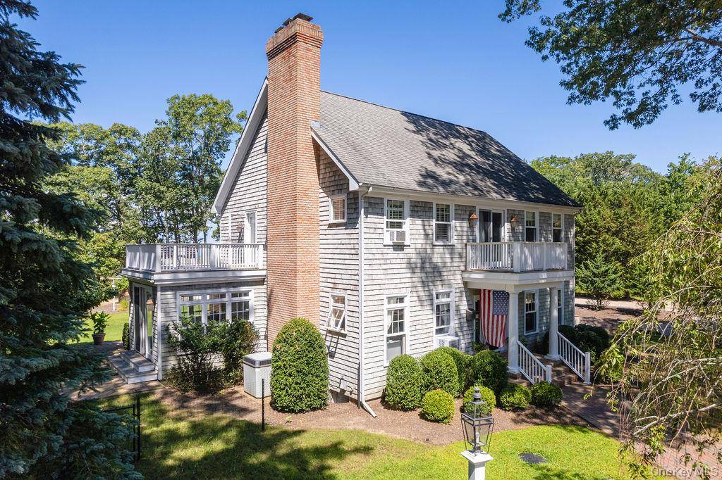 Set on over two secluded acres within the coveted Shellfisher Preserve association near Paradise Point, this extraordinary estate offers sweeping water views from the backyard, kitchen, and upstairs rooms.