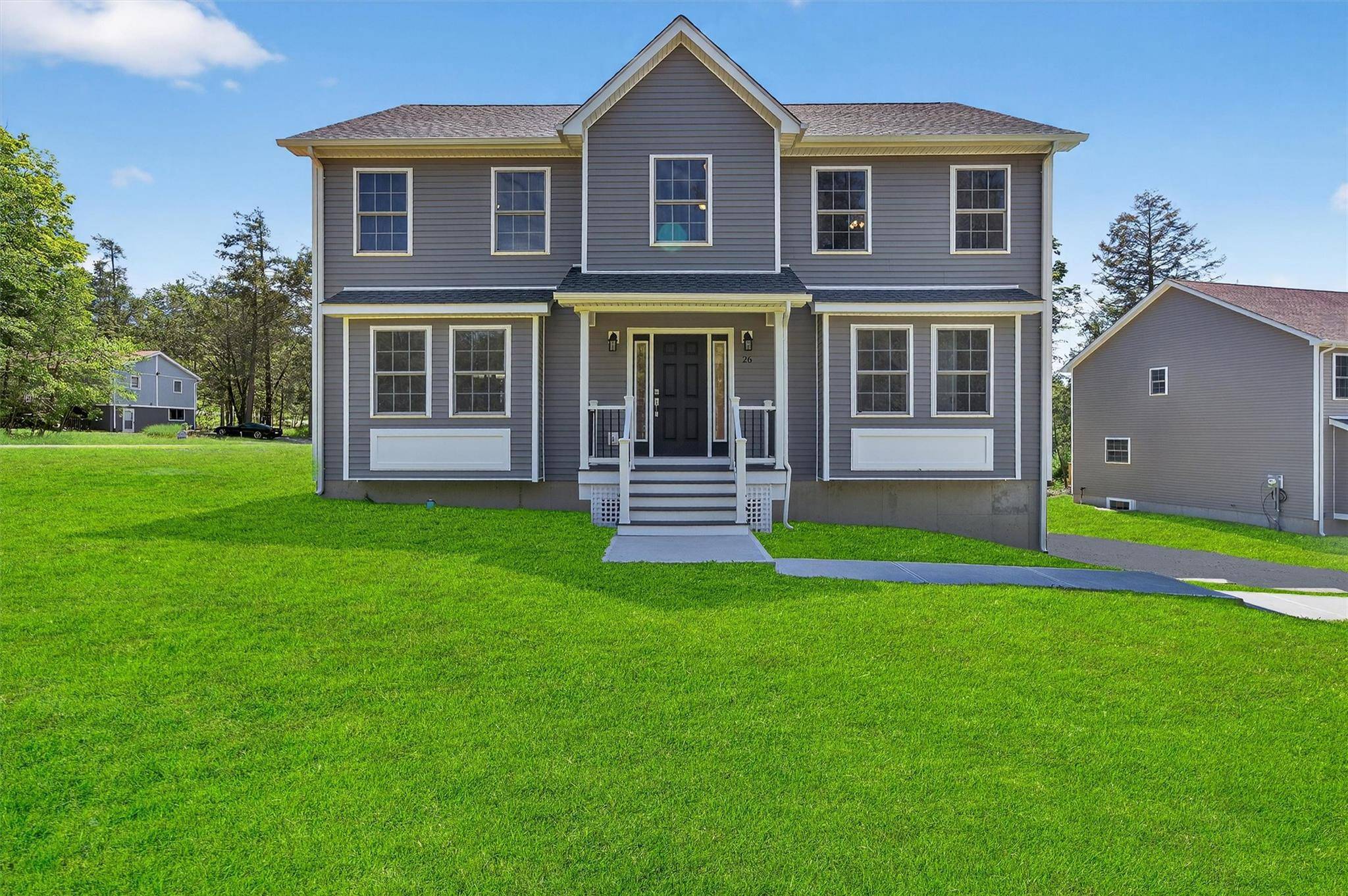 A top tier Orange County NY builder brings his superior craftsmanship to this stunning new colonial in the Lake Louise Marie community.