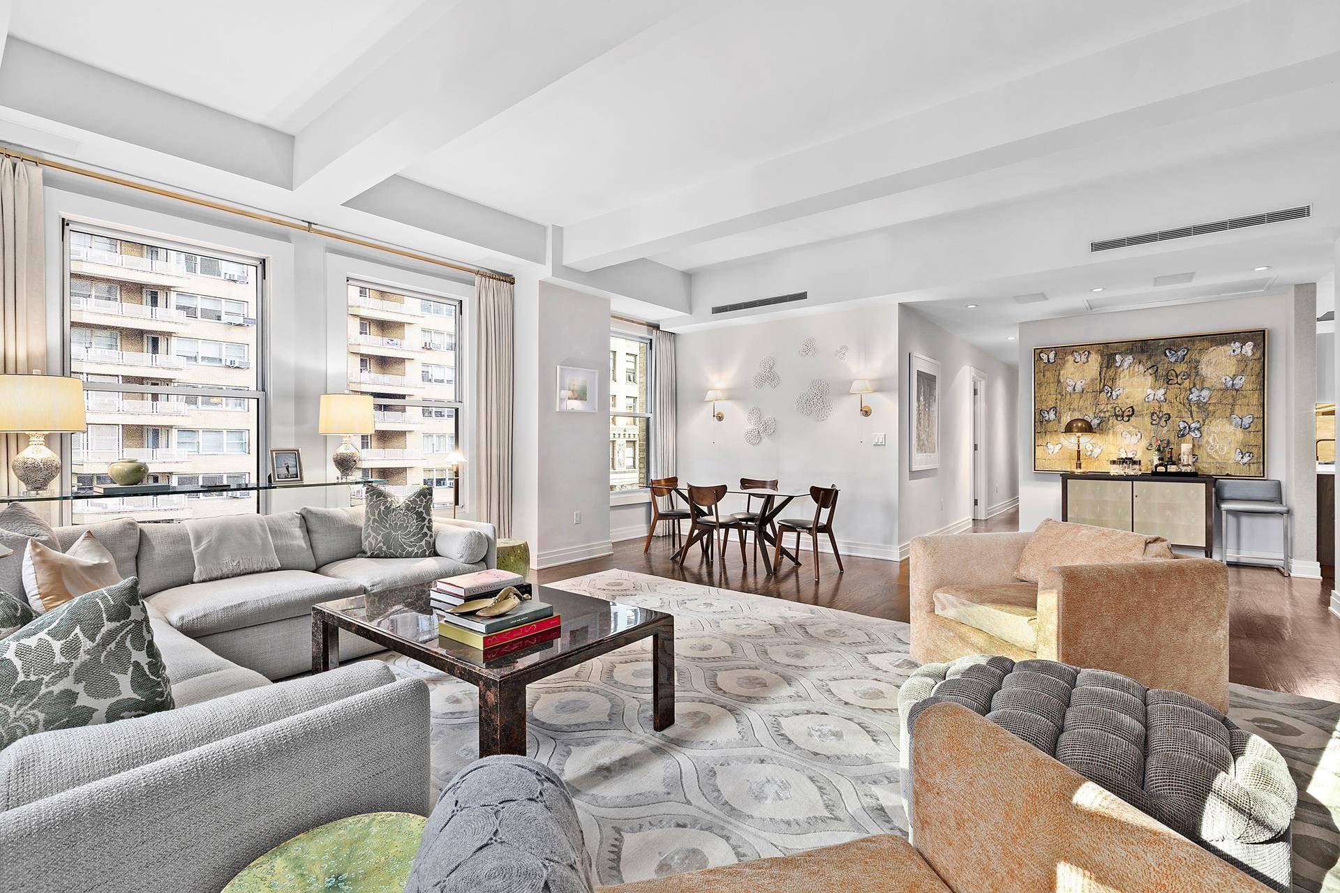 Simply stunning three bedroom with two full baths, one half bath and enormous corner living room, central air conditioning and full time doorman in the heart of NoMad !