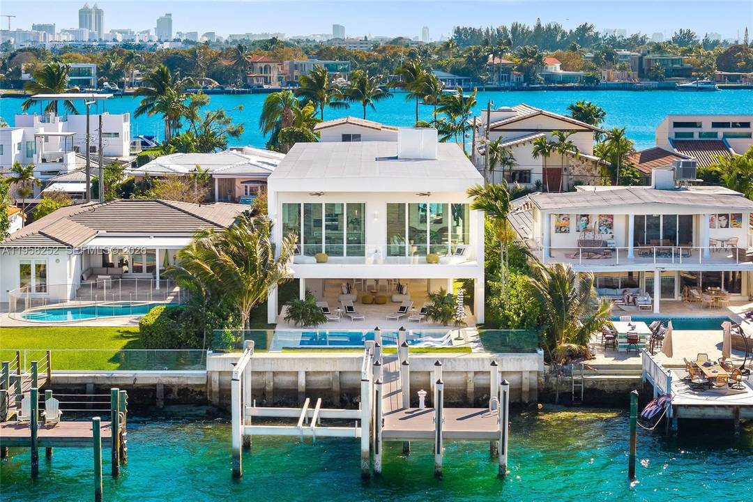 A striking expression of modern waterfront living, this newly constructed residence delivers scale, privacy, amp ; direct access to Biscayne Bay within the gated enclave of Biscayne Point.