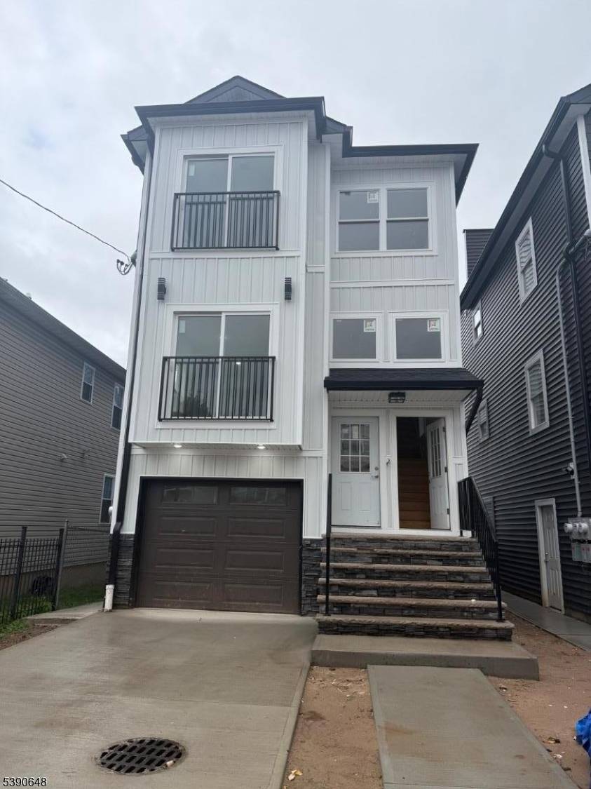 Brand new construction two family home featuring modern finishes and thoughtful design.