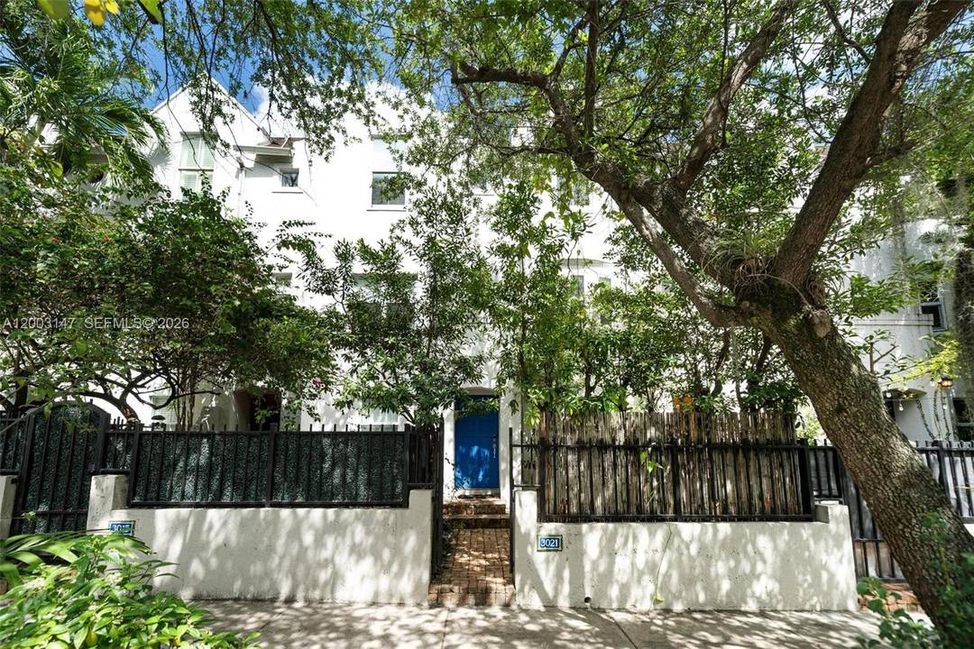 Elegance and character define this tri level townhome in French Village in the Grove, one of Coconut Grove s most charming and sought after communities.