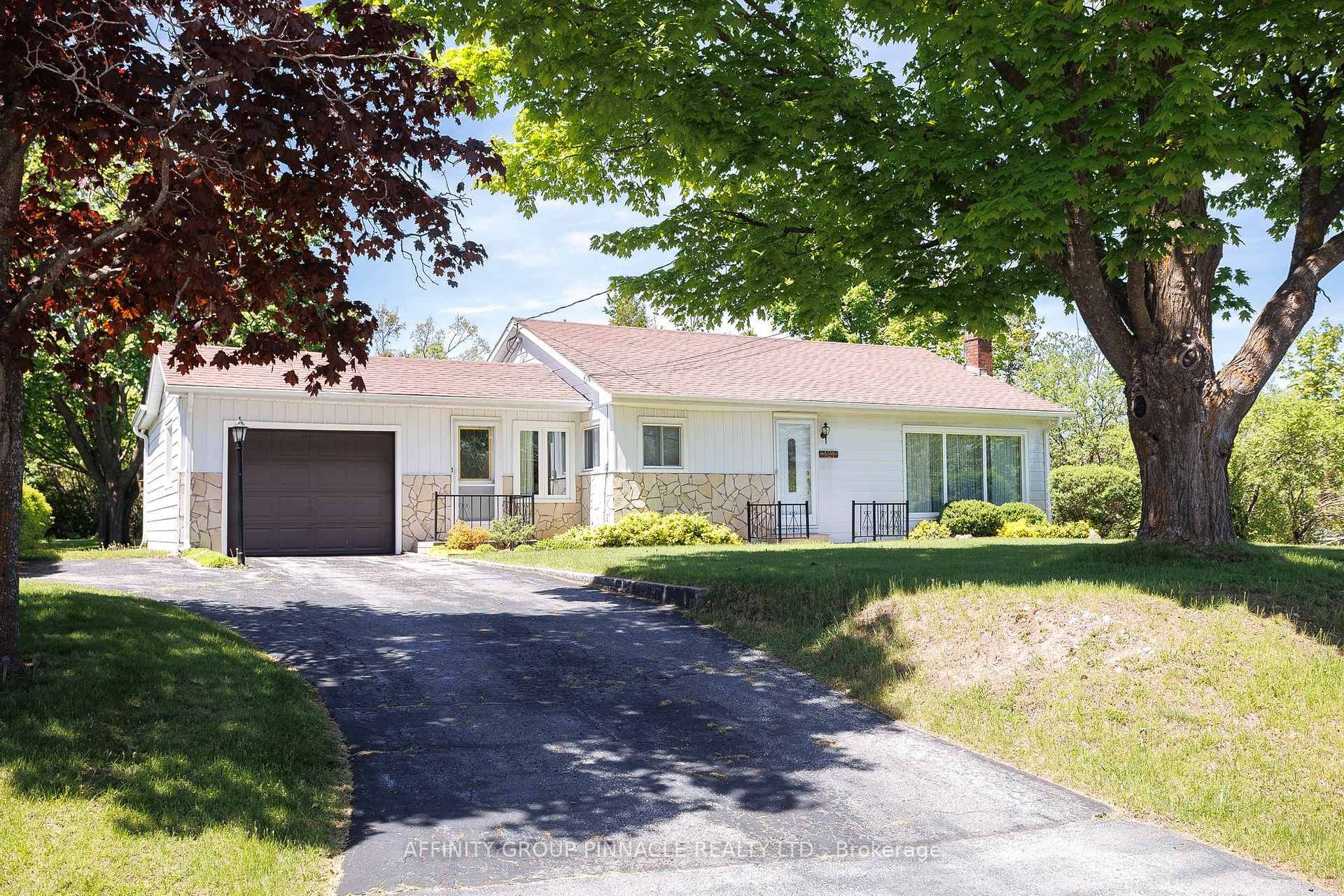Solidly built and well maintained bungalow on park like property in a desirable area of Fenelon Falls.