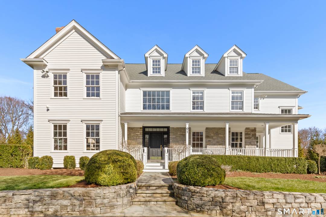 Beautifully sited in prestigious Greens Farms this timeless 5 BR, 6BA clapboard and stone Colonial offers stunning architecture resort like privacy just moments from train, town beaches.