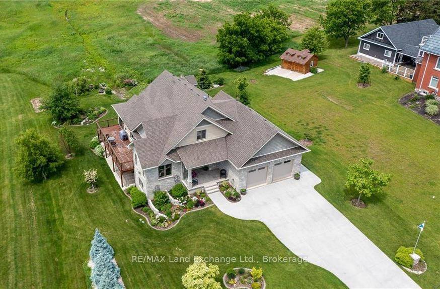 Enjoy stunning sun sets from the West facing deck of this custom built 4 BR home over looking Walkerton.