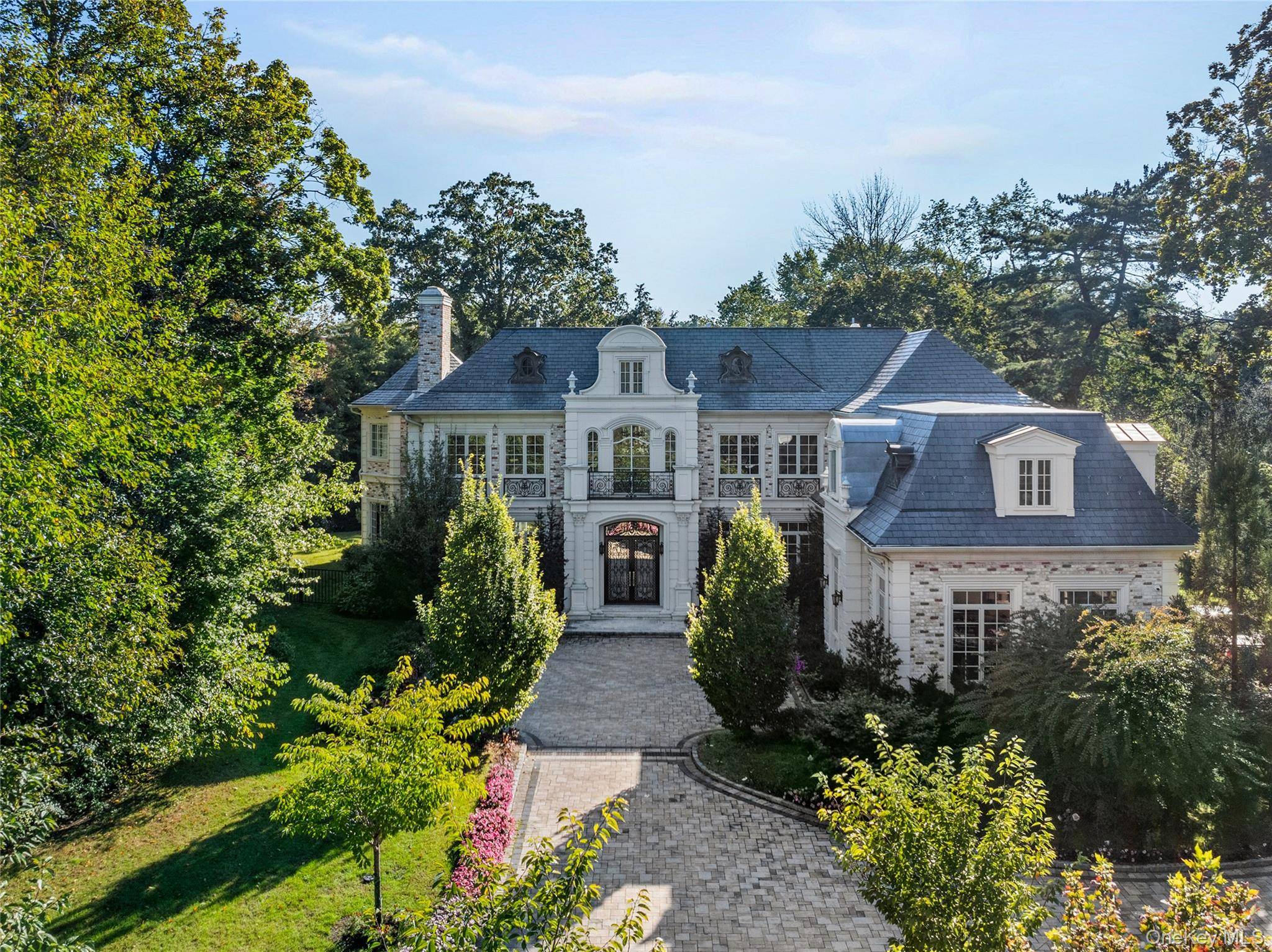 Welcome to 6 Foxwood Road, an extraordinary Colonial estate nestled in the heart of Kings Point, NY.
