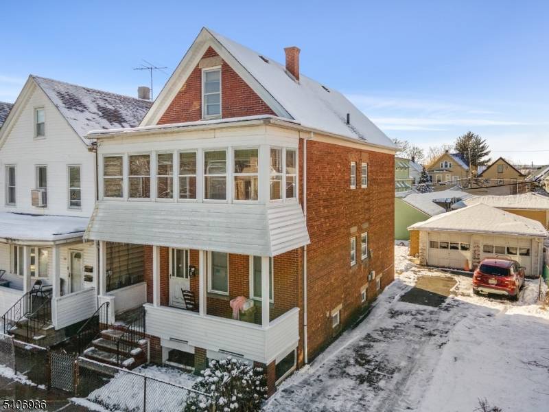 Classic two family home in Clifton offering strong upside potential for investors or owner occupants.