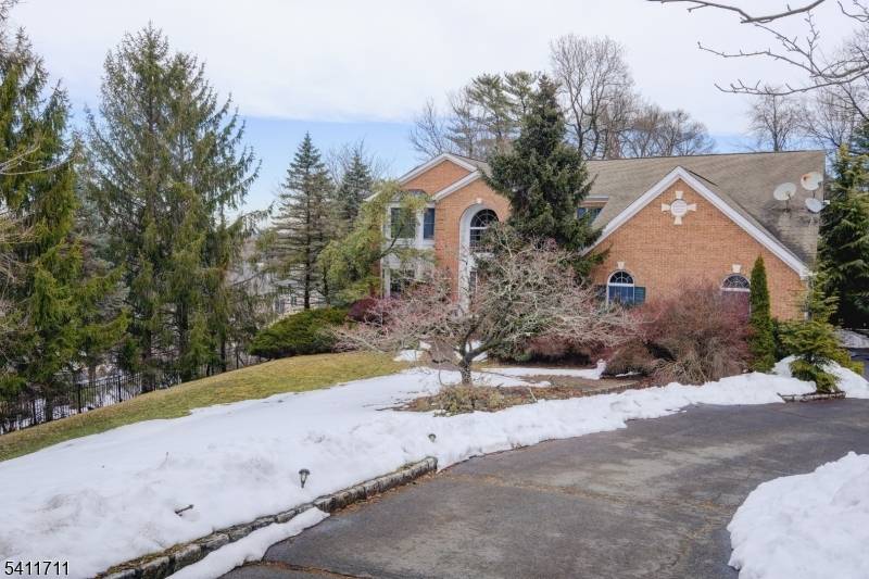 Welcome to this classic brick Colonial located on sought after Tree Top Ln in one of Chatham's most established residential neighborhoods.