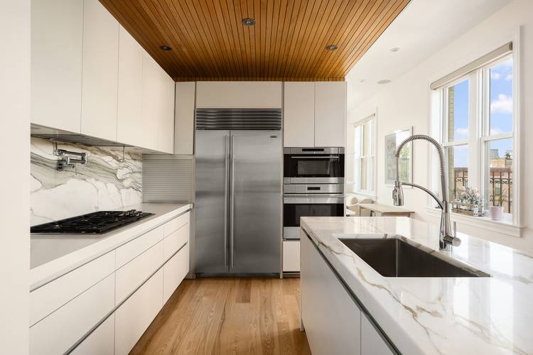 Just one block from Prospect Park, this beautifully finished four bedroom, three bathroom condominium offers exceptional space, light, and comfort in the heart of Park Slope.
