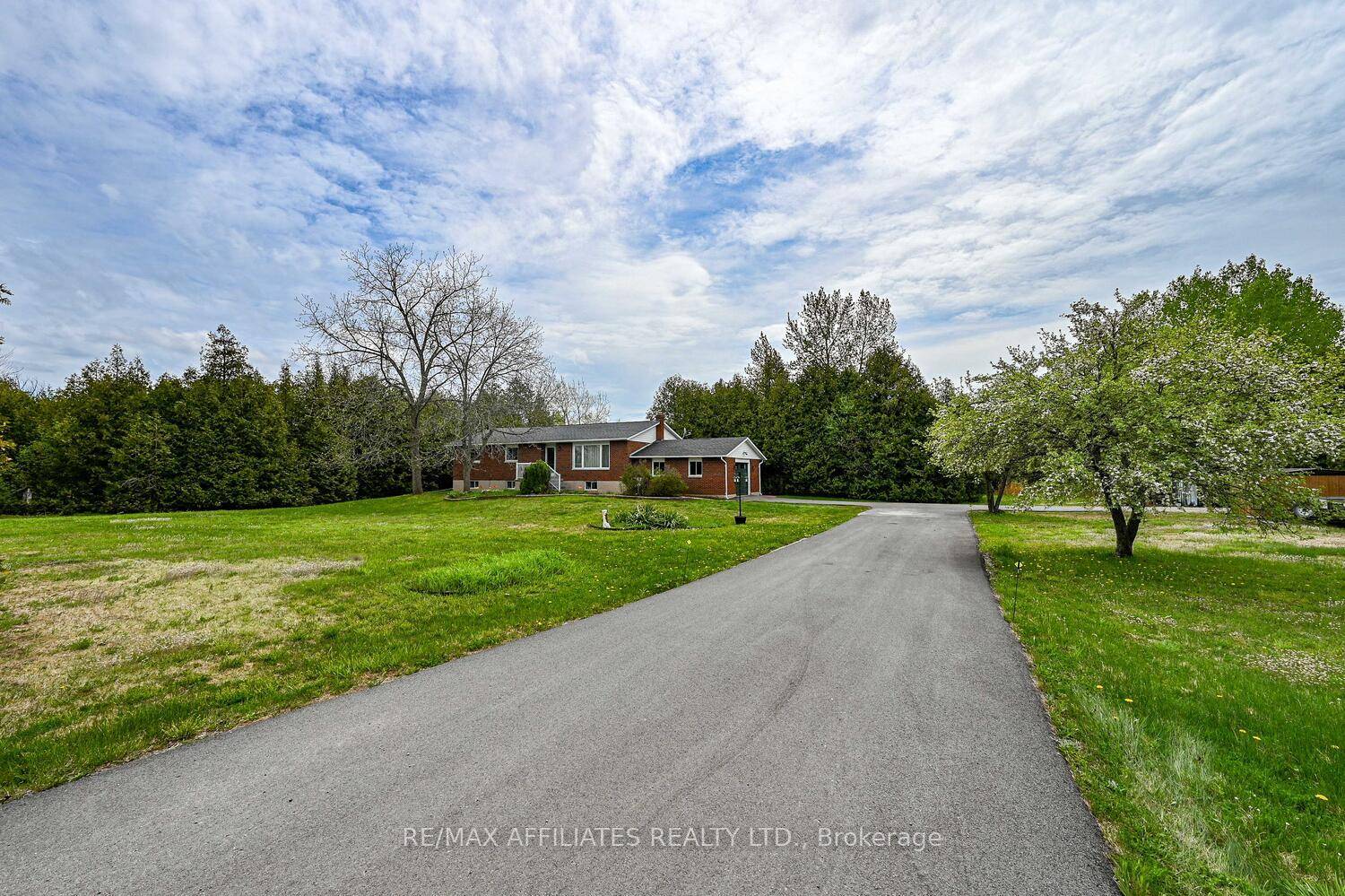 Nestled on a serene 1. 9 acre corner lot, this beautifully maintained brick bungalow offers the perfect blend of country tranquility and modern convenience.