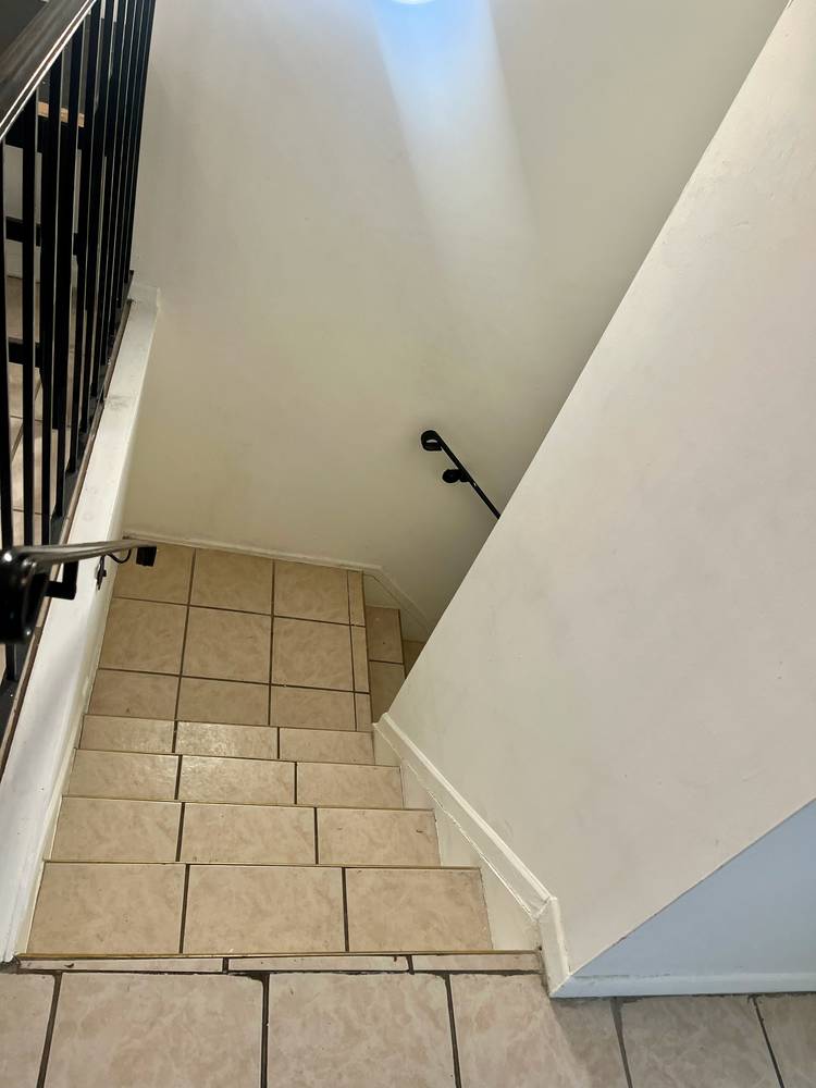 Large boxed 2 bedroom apartment with a small windowed home office off the living room.