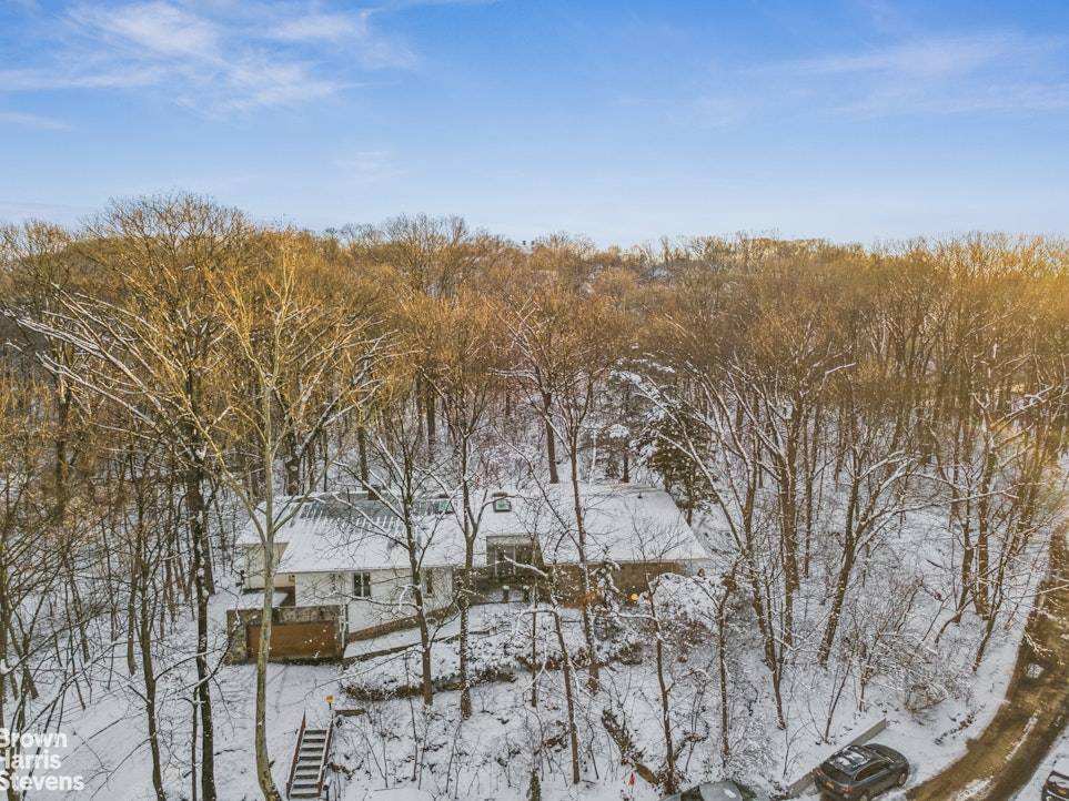 A Sanctuary Above the City Riverdale Perched atop a serene, south facing half acre in the coveted North Riverdale section of the Bronx, this extraordinary one level residence offers a ...