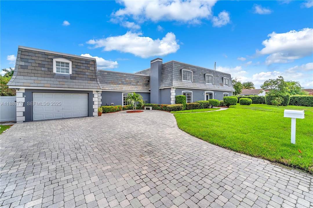 Impressive waterfront estate offering scale, privacy, and versatility in the heart of Lighthouse Point.