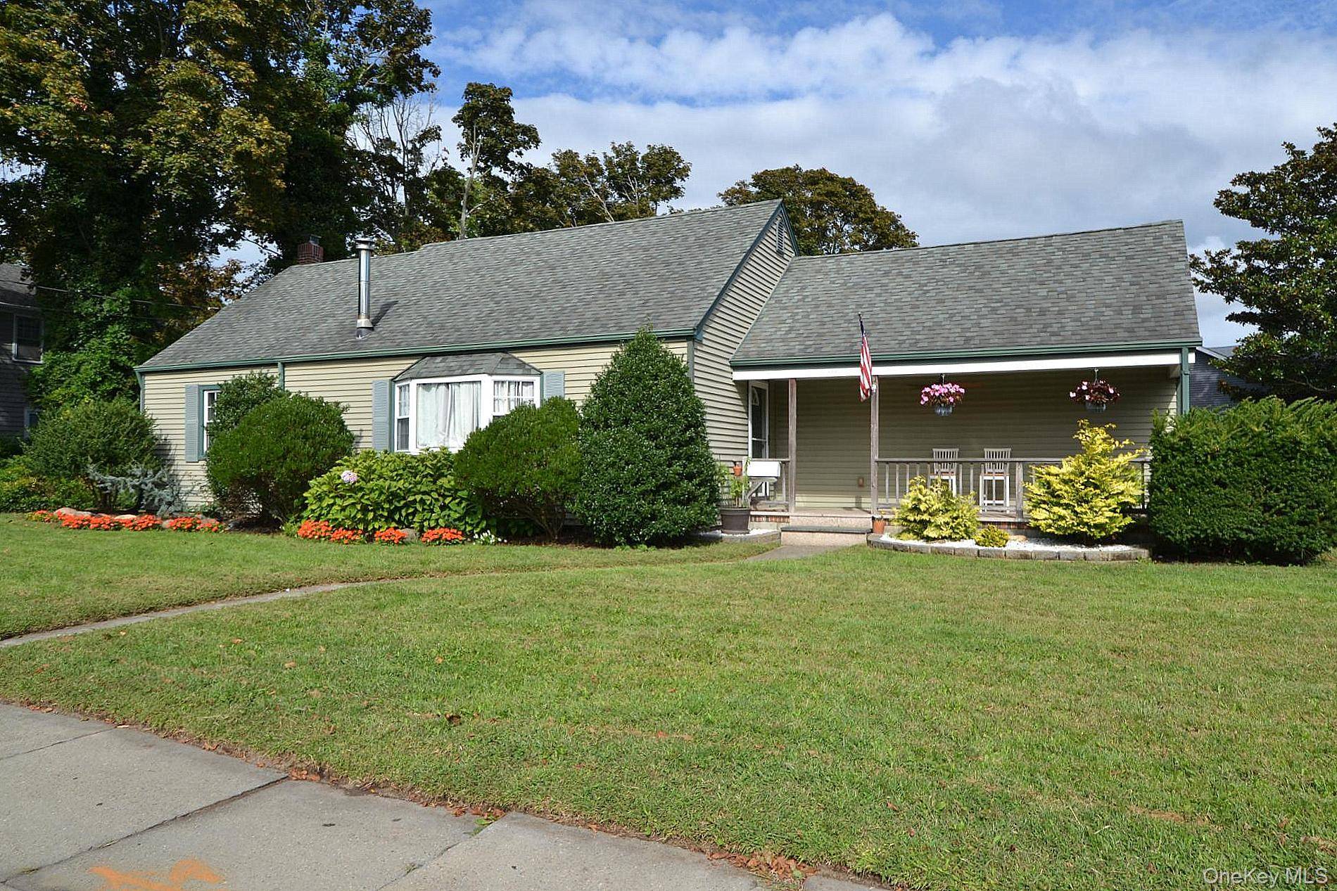 Welcome home to this beautifully maintained ranch situated on a corner, fully fenced lot with a covered front porch.