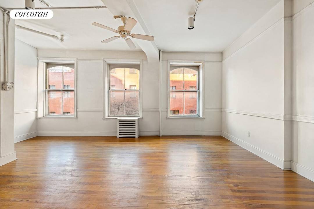 WEST VILLAGE GEM. From the moment you walk into this unique corner loft with 13 windows and 3 bright exposures, there's an almost indescribable feeling of WOW.