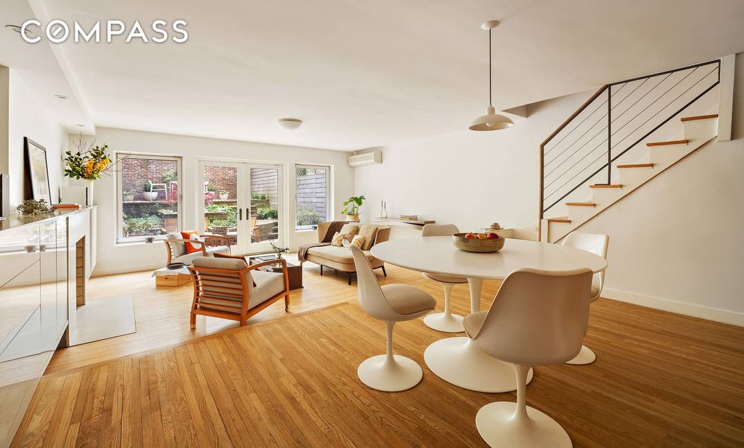 This elegant, turnkey three bedroom garden triplex offers a rare blend of contemporary comfort and charm.