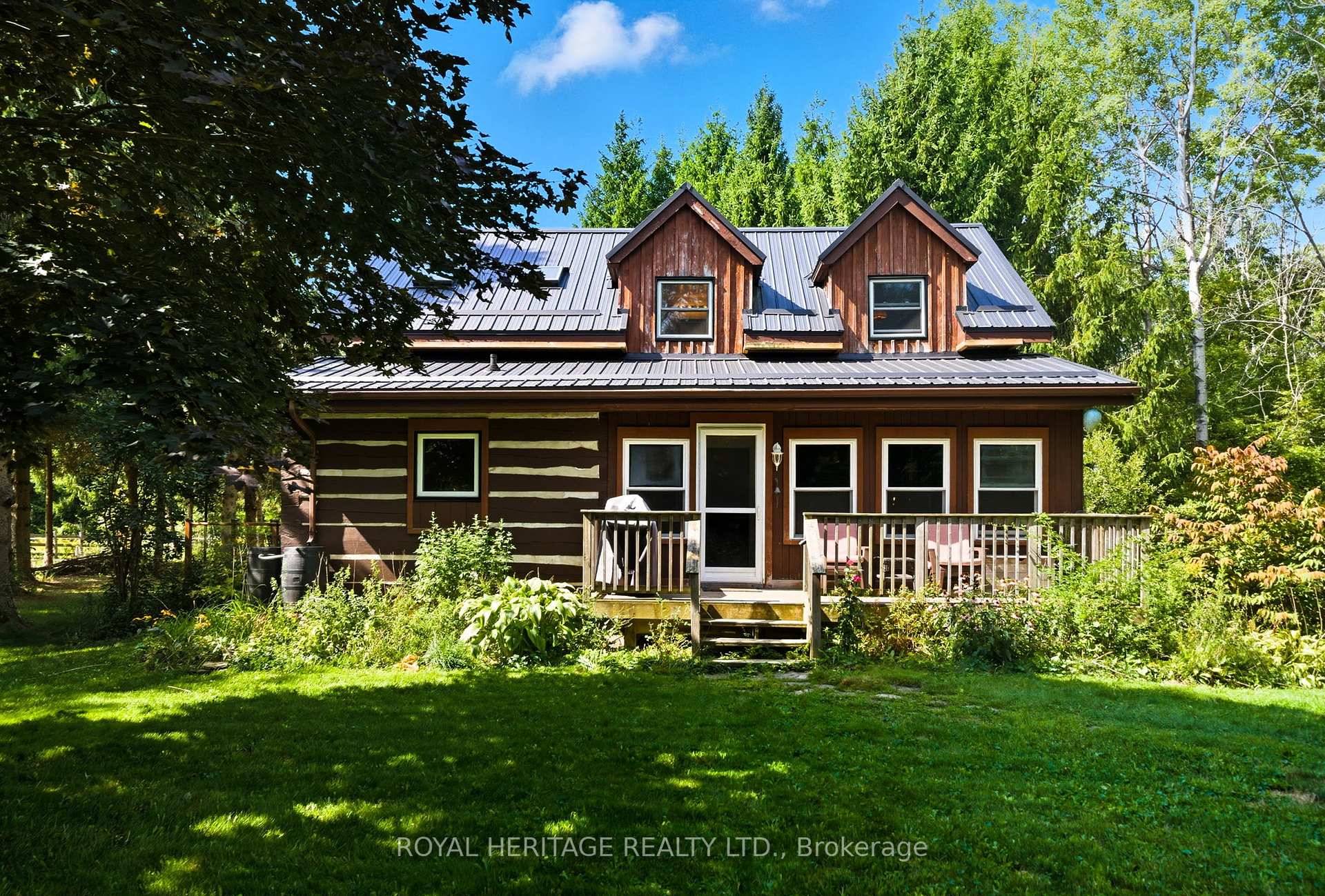 Rustic charm meets modern comfort in this stunning log home set on over 7 acres of peaceful, private land.