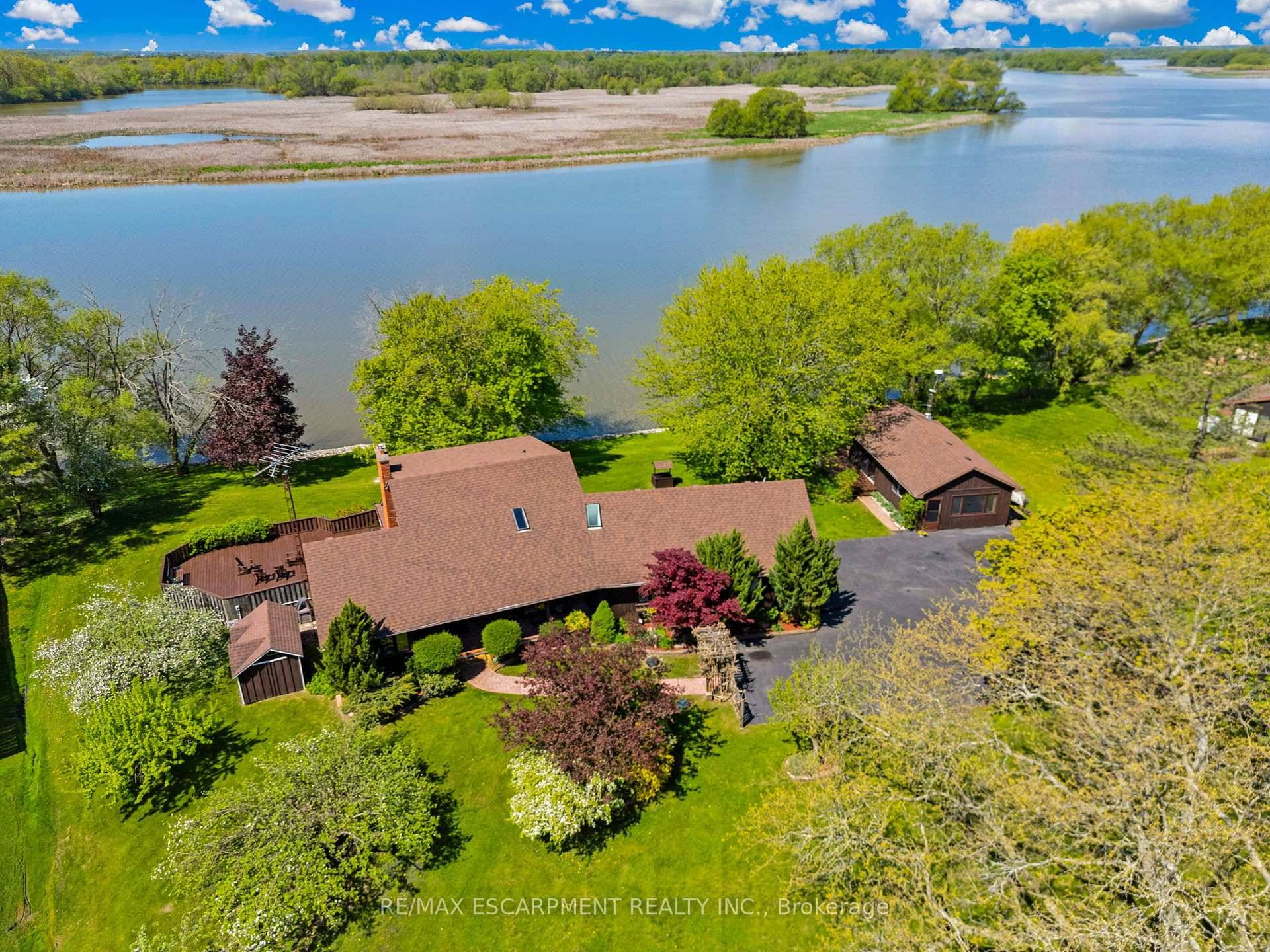 Unrivalled Grand River waterfront estate in a rarely offered location !