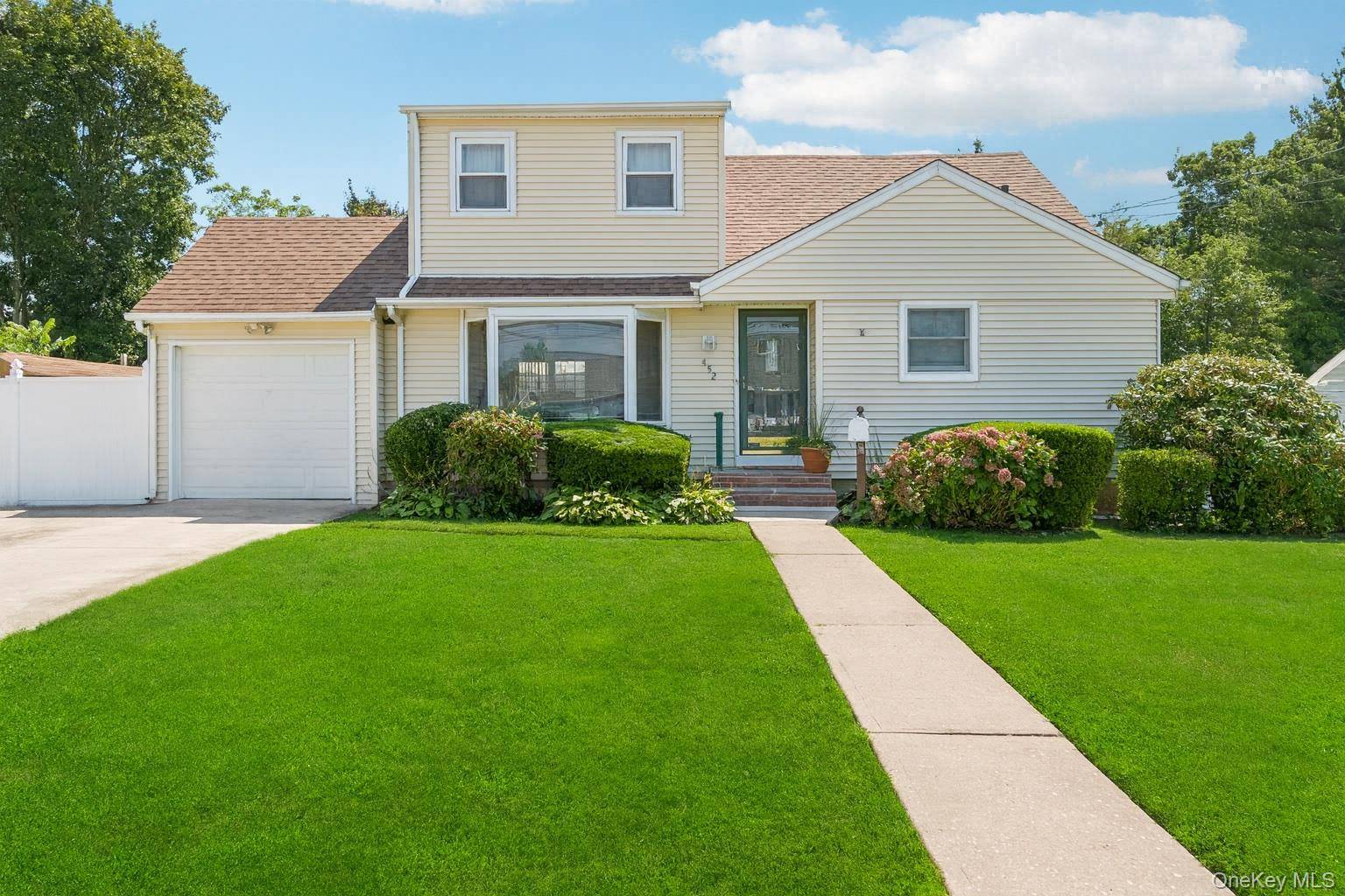 Welcome to this expanded Cape located on a picturesque street within the West Babylon School District.