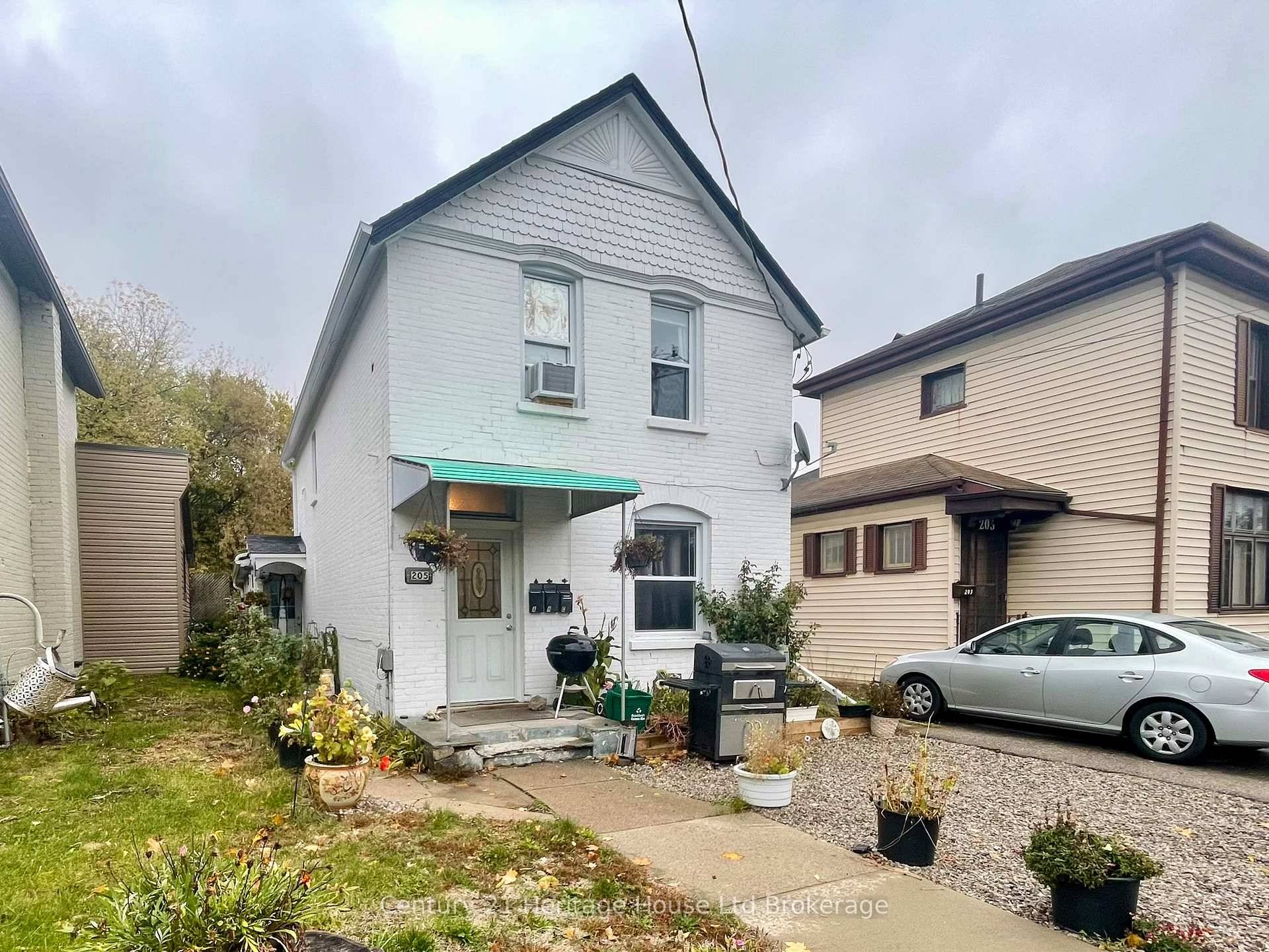 LEGAL Triplex ! Welcome to 205 William Street, Brantford a well kept, legal triplex offering a fantastic opportunity for investors seeking steady, reliable income.