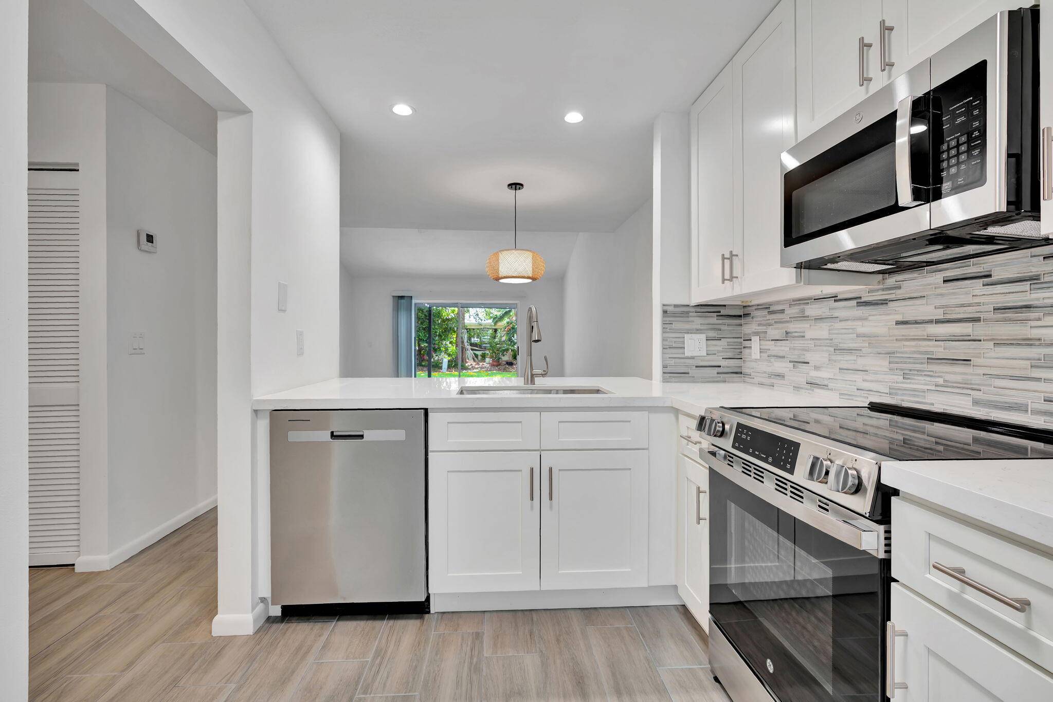Step inside this beautifully updated townhouse villa.