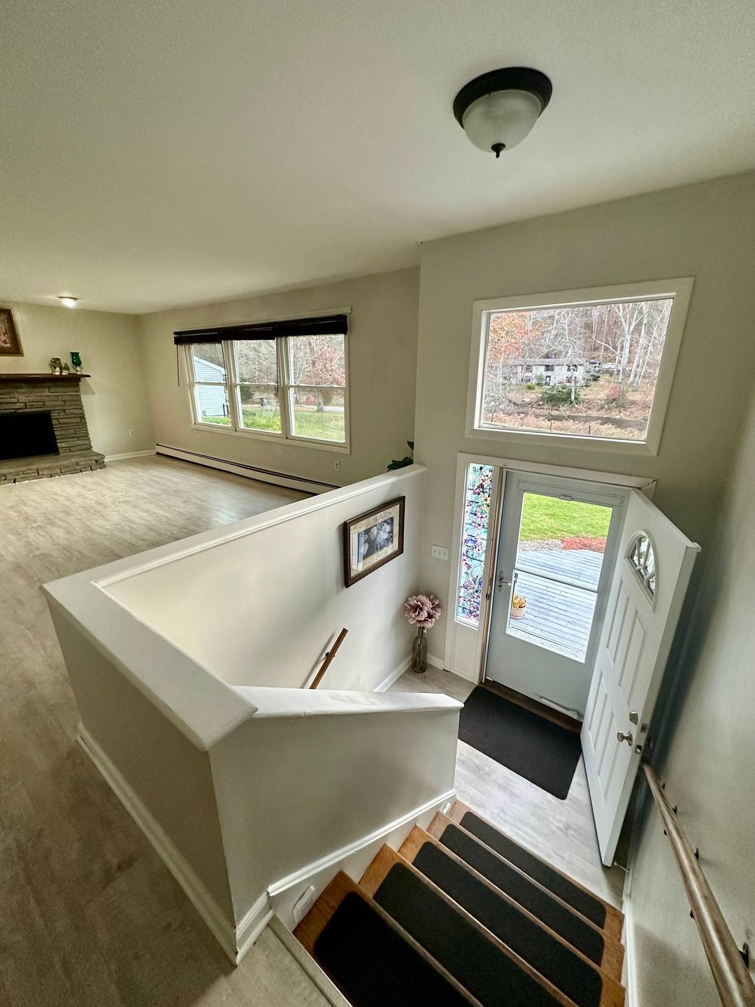 Remodeled kitchen with stainless steel appliances, cabinets, and granite counter.