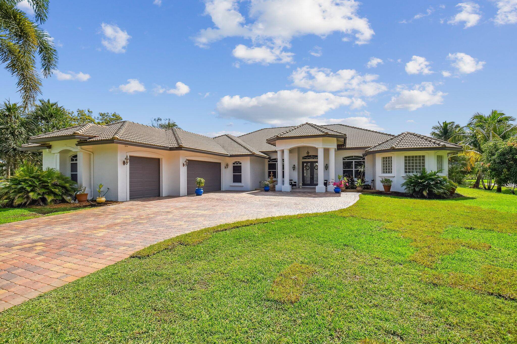 Gorgeous Estate property on just over an acre, located in the prestigious gated community of Delray Lake Estates.
