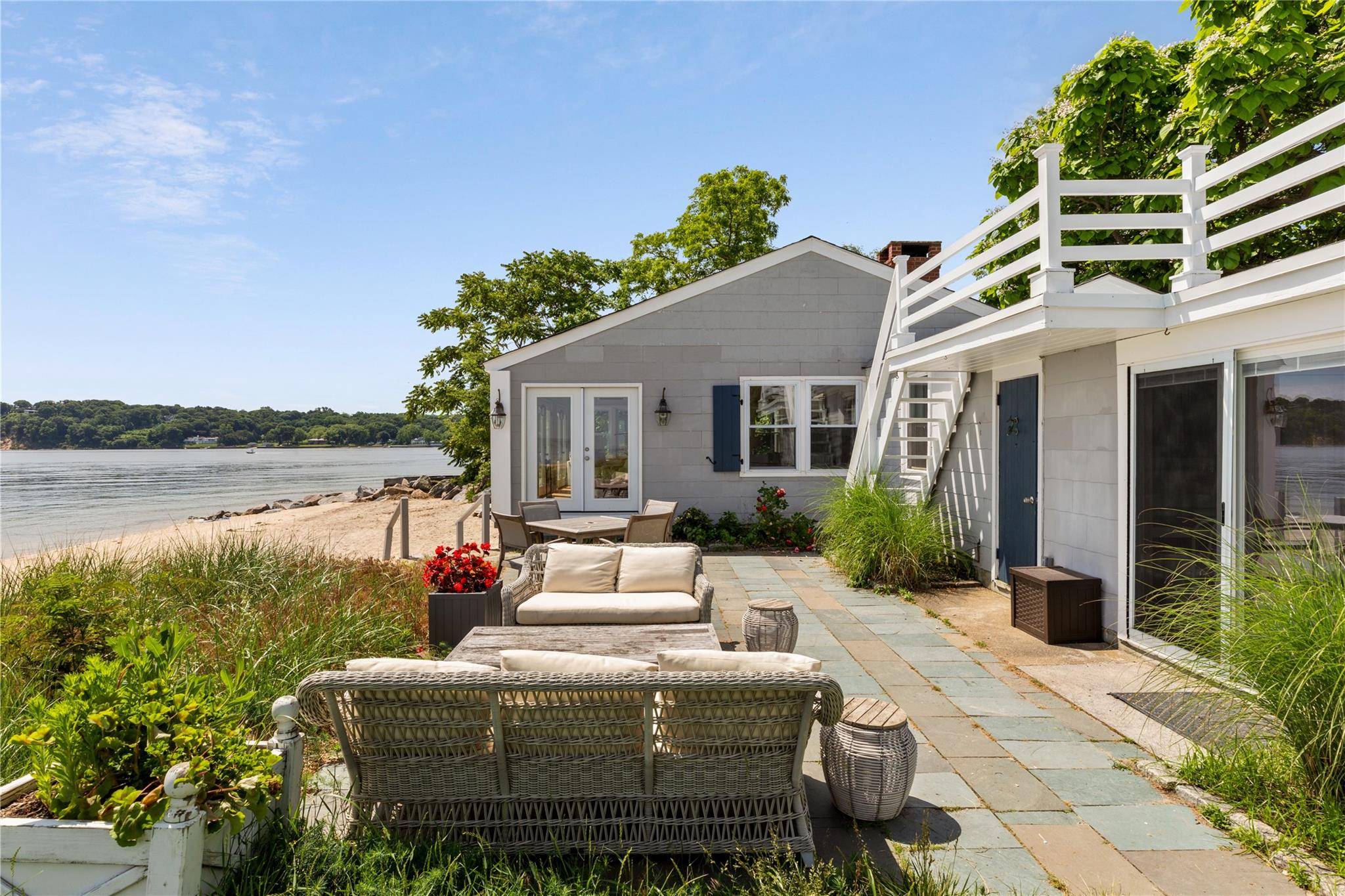 Welcome to Seaview a beautifully redesigned 3 bedroom beach bungalow boasting 400 feet of direct waterfront on a prestigious Gold Coast estate property in Centre Island, New York.