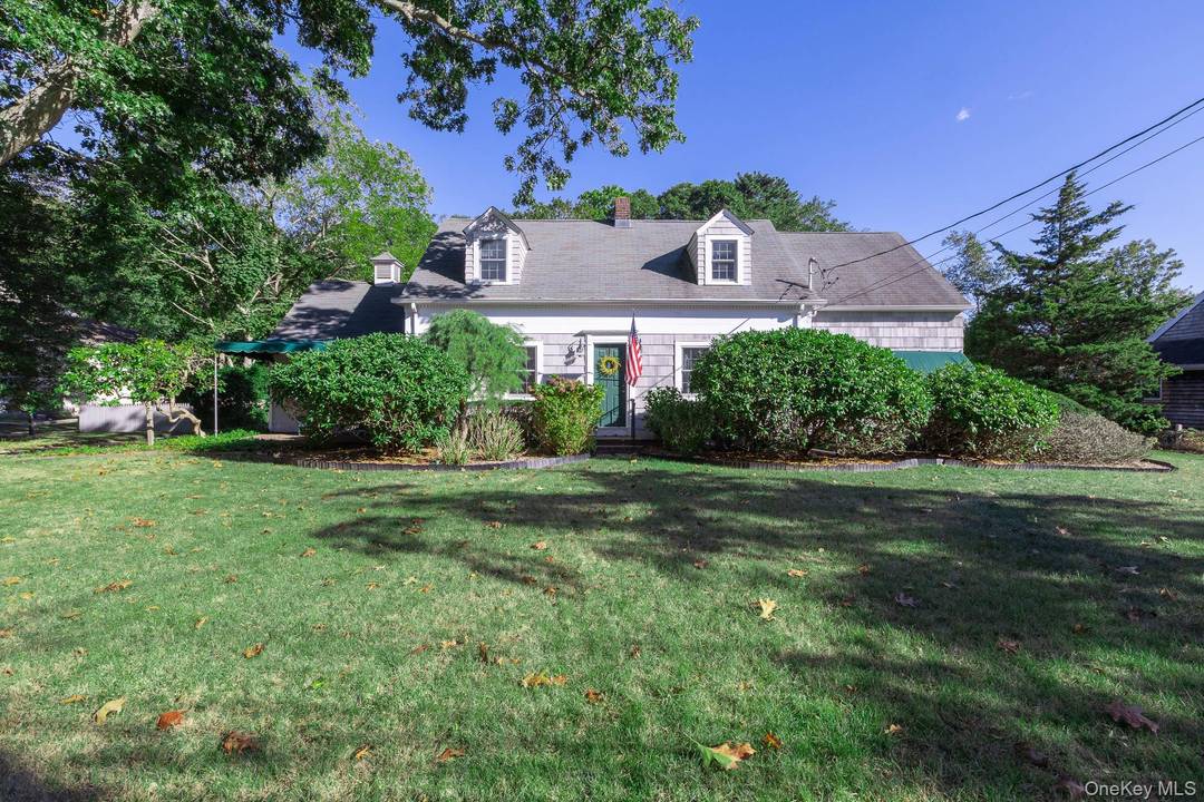 Classically charming single family residence nestled in the heart of Center Moriches.